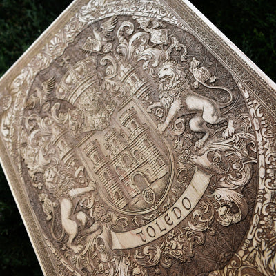 Toledo Spain city shield engraved on wood, elegant heritage wall decor.
