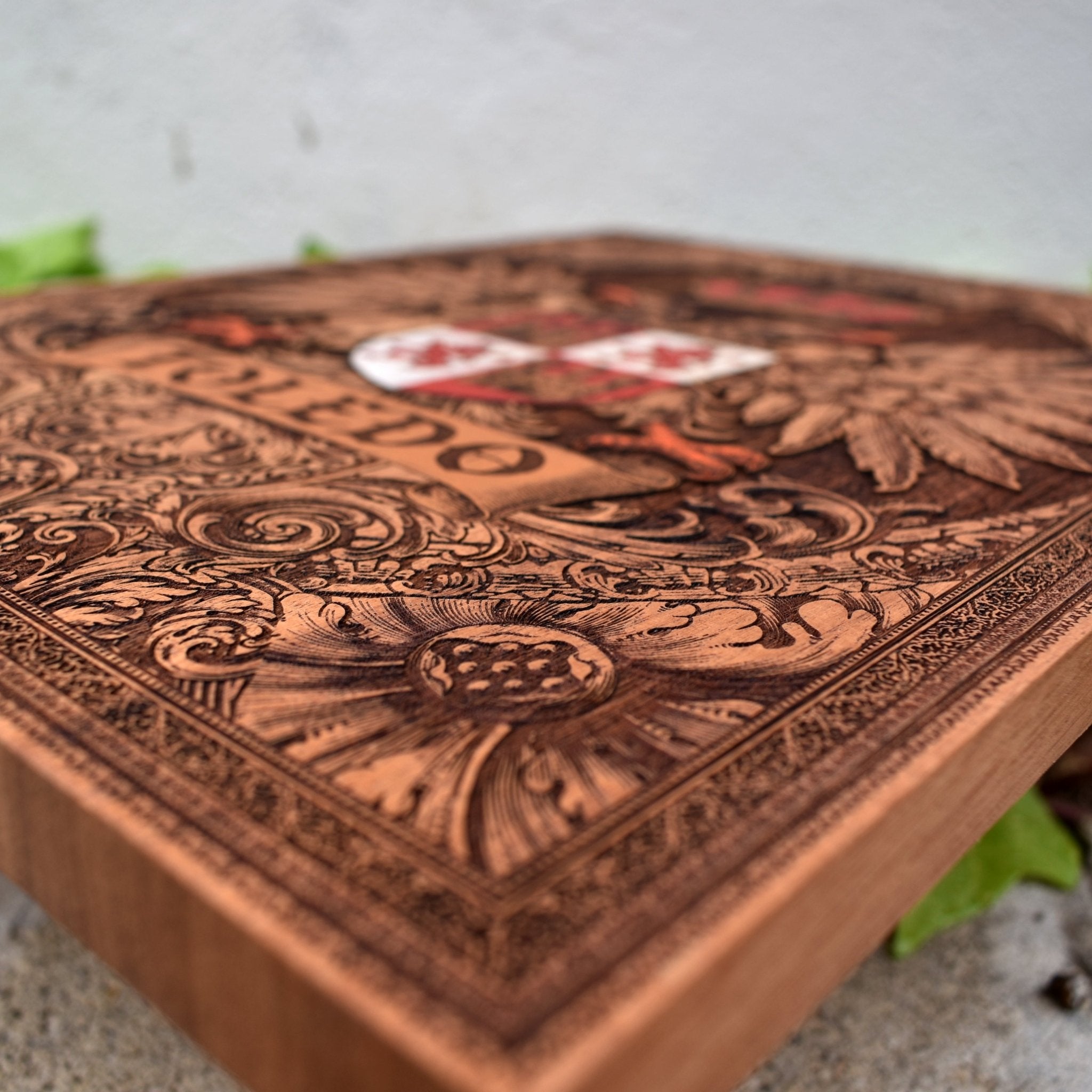 Engraved wooden wall poster featuring the historic coat of arms of Toledo, Spain, with intricate heraldic details carved into natural wood.