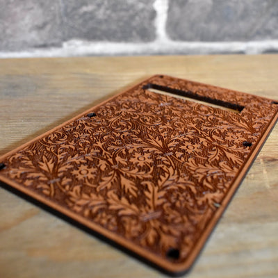 Handcrafted cherry wood tremolo cover installed on a Fender Stratocaster guitar