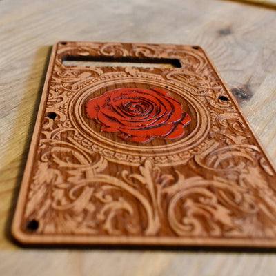 Unique laser-engraved tremolo cover for Stratocaster guitars, finished with a hand-painted touch