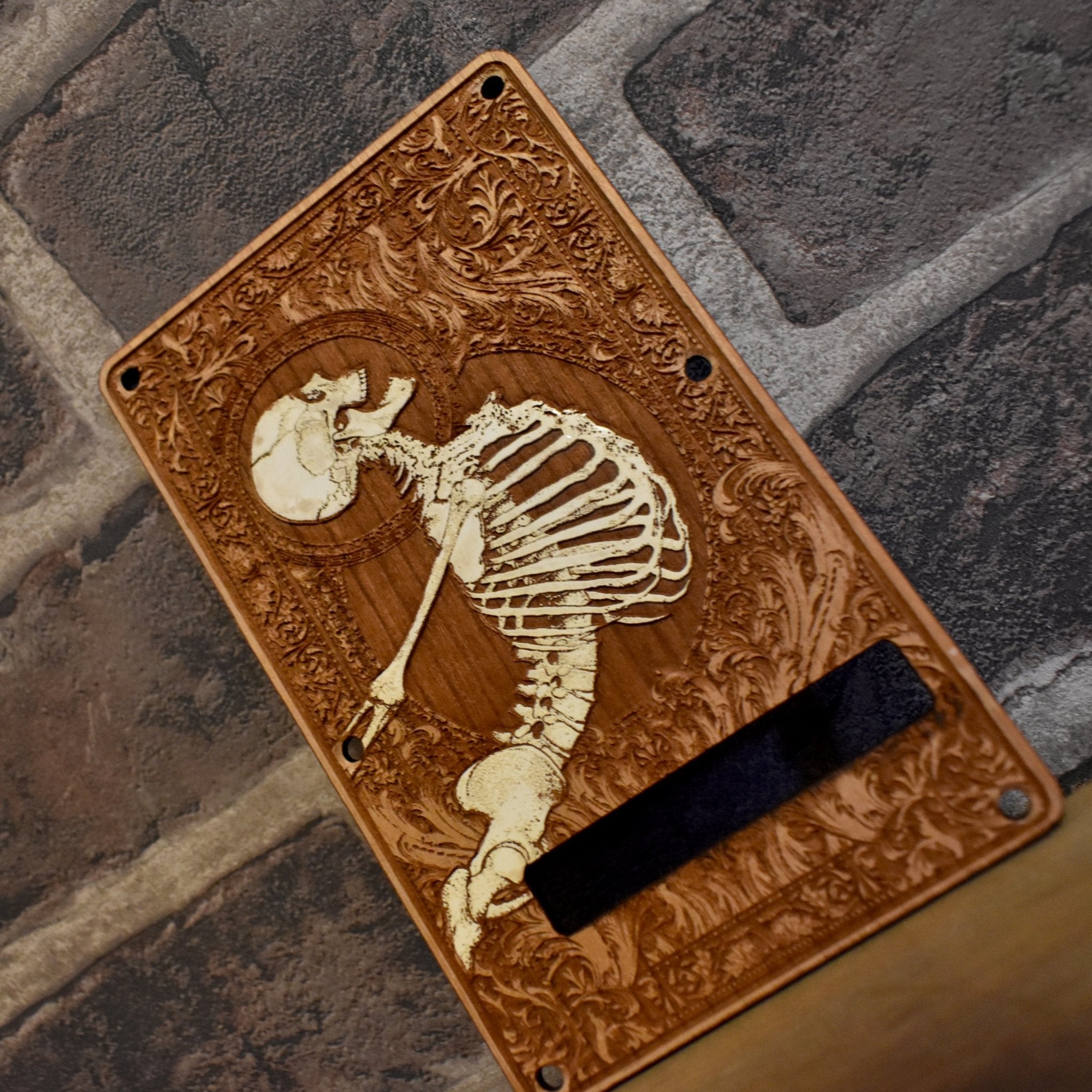 Hand-finished Stratocaster tremolo cover with detailed laser-engraved artwork