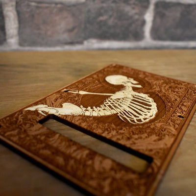 Close-up of unique cherry wood tremolo cover for Stratocaster, perfect for SSS & HSS models