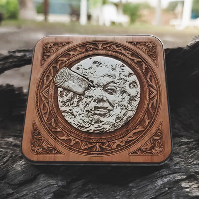 Overhead view of sci-fi moon design on artisan wood charger.