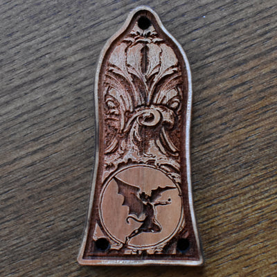 Black engraved truss rod cover for Epiphone guitar, featuring gothic floral design, handcrafted by Engraver’s Dungeon.