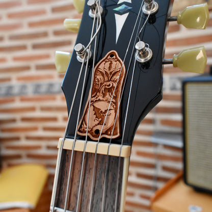 Black engraved truss rod cover for Gibson Les Paul, featuring dark gothic floral design, handcrafted by Engraver’s Dungeon.