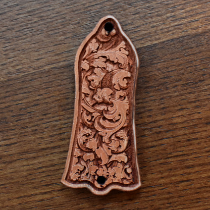 Custom cherrywood truss rod cover for Gibson Les Paul, featuring detailed floral engraving in gothic style, handcrafted by Engraver’s Dungeon.