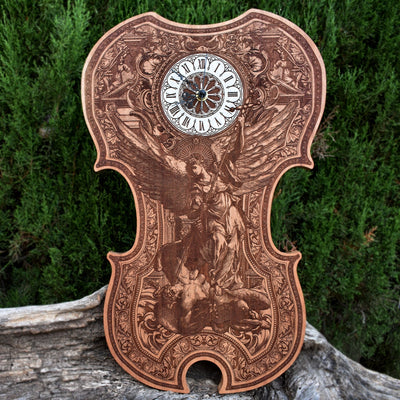 Handmade cedar wood violin clock with St. Michael laser engraving. Unique wedding & anniversary gift for music lovers & spiritual décor collectors.