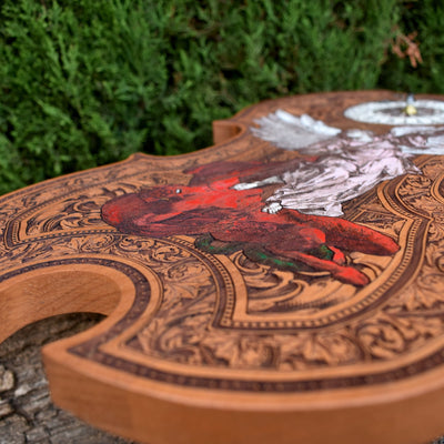 Unique cedar wood violin-shaped wall clock with intricate St. Michael artwork.