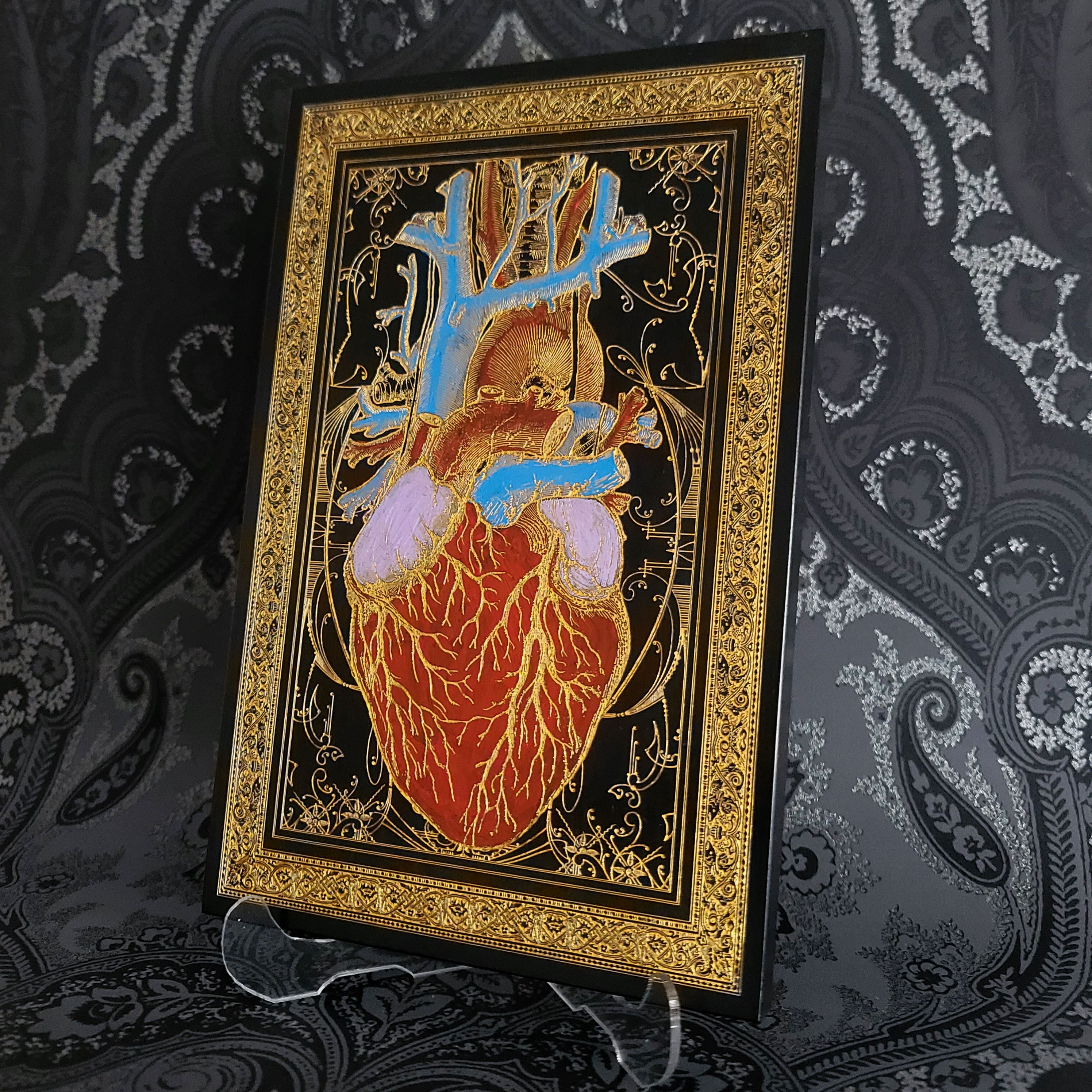 Black and gold anatomical heart wood wall art, perfect for gothic home decor.
