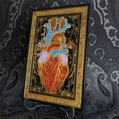 Black and gold anatomical heart wood wall art, perfect for gothic home decor.