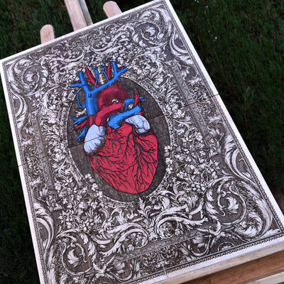 Detailed close-up of a hand-painted anatomical heart on maple wood, showcasing fine brush strokes, texture, and depth, making it a stunning decorative piece.