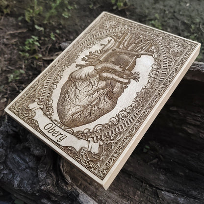 Handcrafted anatomical heart art on wood with personalized text banner