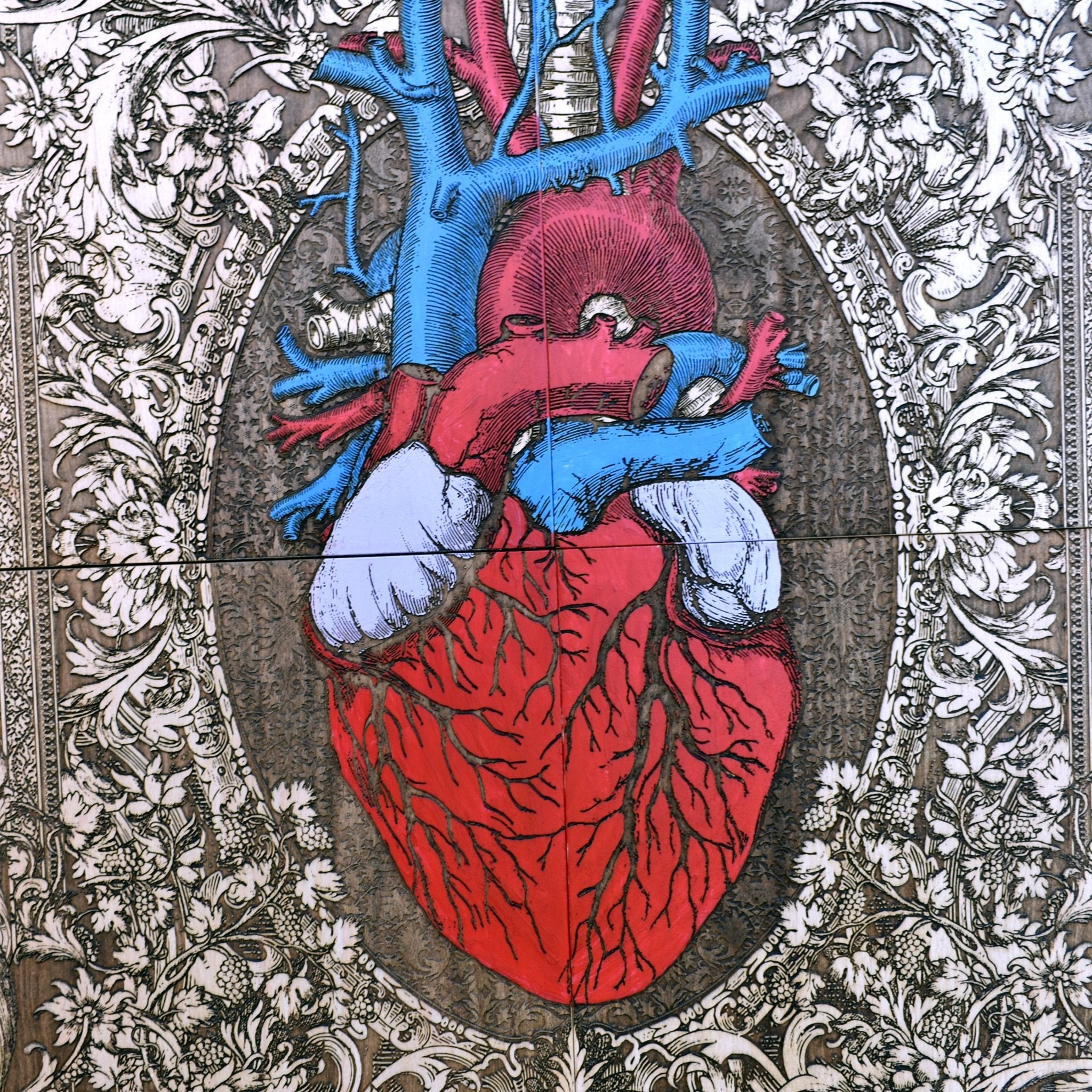 Anatomical heart artwork displayed on a wall, adding a bold and artistic statement to gothic, tattoo-inspired, or modern rustic home decor.