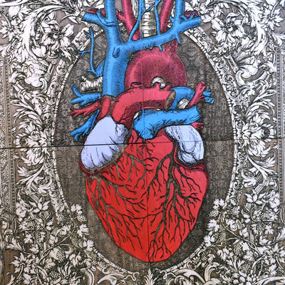 Anatomical heart artwork displayed on a wall, adding a bold and artistic statement to gothic, tattoo-inspired, or modern rustic home decor.