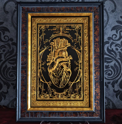 Black anatomical heart wood wall art, engraved for gothic or romantic decor.