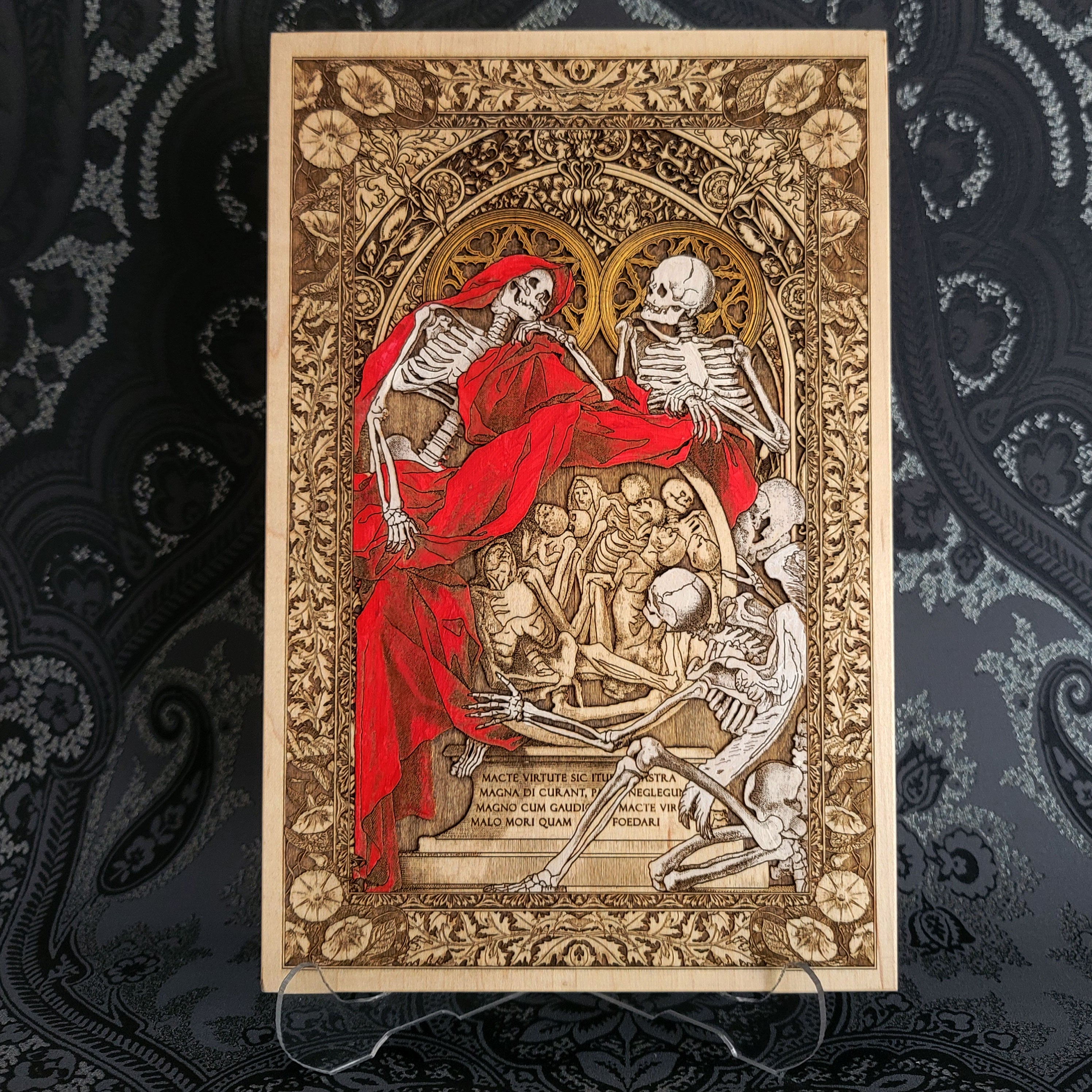 Decorative print with skeletons and a red cloth on an ornate background