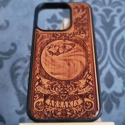 Laser engraved Arrakis wood phone case with desert dunes and sci fi landscape