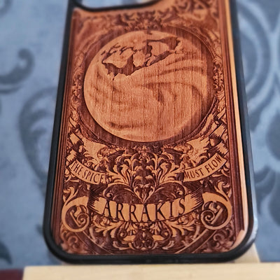 Engraved wood phone case with desert planet landscape and black protective bumper