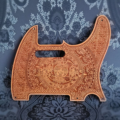 Aztec wood pickguard for Telecaster electric guitar, laser-engraved design.
