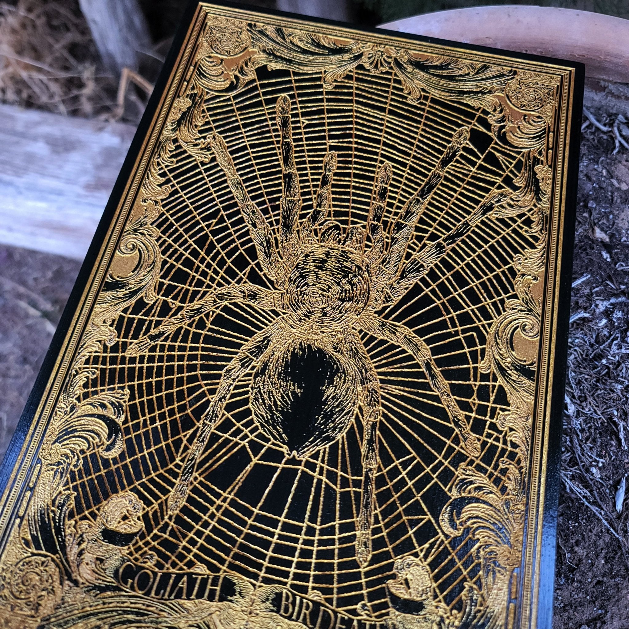 Tarantula wood wall hanging with golden pigment, gothic spider decor.