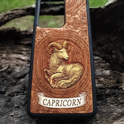 Hand-painted Capricorn horoscope phone case on natural wood