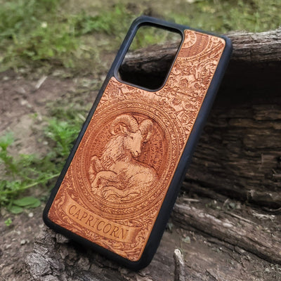Artistic Capricorn phone cover made from natural wood with horoscope engraving