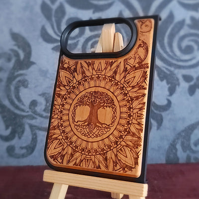 Engraved wooden phone case featuring Celtic tree symbol and intricate geometric floral design