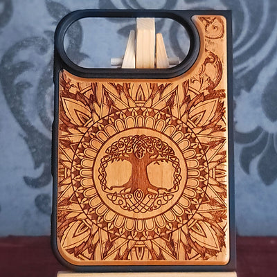 Celtic Tree of Life laser engraved on real cherrywood phone case with detailed knotwork mandala