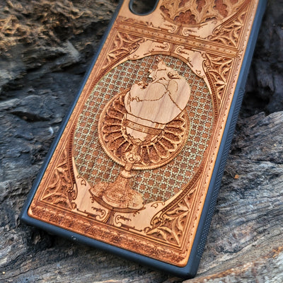 Gothic chalice artwork engraved on a wooden phone case, compatible with iPhone and Samsung Galaxy