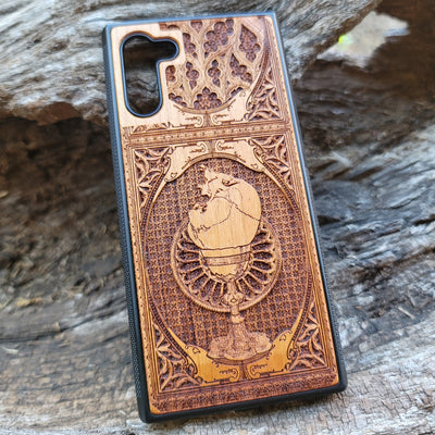 Wooden phone case with a skull inside a chalice design, intricately engraved for iPhone , Samsung Galaxy S, and more. Ideal for gothic and dark fantasy lovers, offering stylish protection for your device