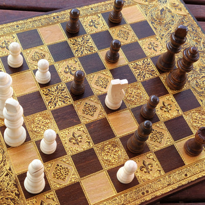 Close-up of detailed laser-engraved patterns on premium wood chessboard, an elegant gift for anniversaries & collectors.