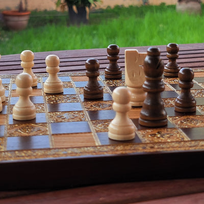 Side view of premium chessboard showcasing intricate engraving, a timeless heirloom-quality gift for chess lovers.