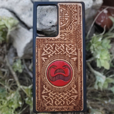 Painted wood phone case with Conan the Barbarian snake symbol and Celtic designs for iPhone and Galaxy