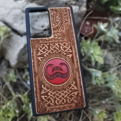 Painted wood phone case with Conan the Barbarian snake symbol and Celtic designs for iPhone and Galaxy