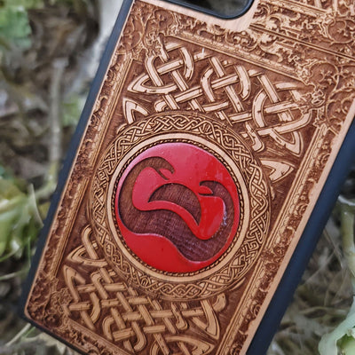 Painted wood phone case with Conan the Barbarian snake symbol and Celtic designs for iPhone and Galaxy