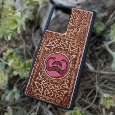 Painted wood phone case with Conan the Barbarian snake symbol and Celtic designs for iPhone and Galaxy
