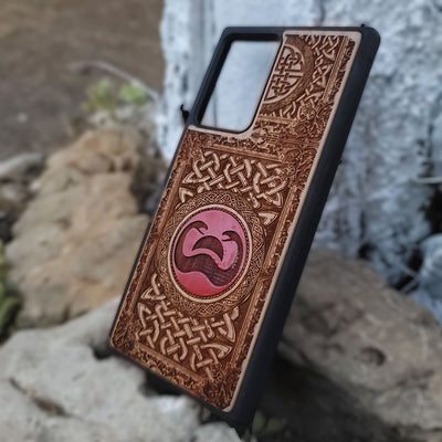 Painted wood phone case with Conan the Barbarian snake symbol and Celtic designs for iPhone and Galaxy