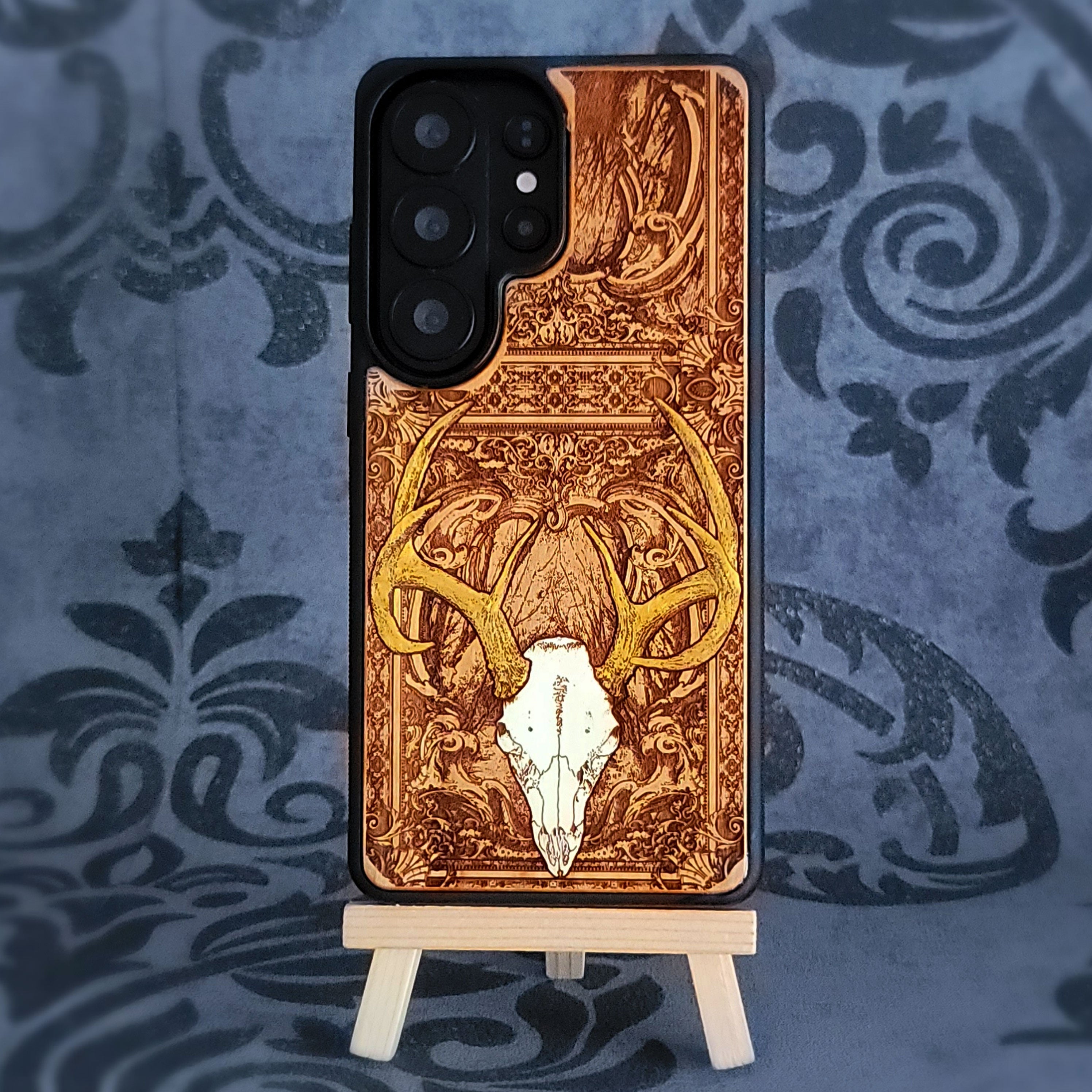 Phone case with deer design on a decorative background