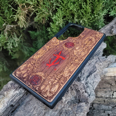 Doom-inspired gothic artwork engraved on a wooden phone case, compatible with iPhone  and Samsung Galaxy S.