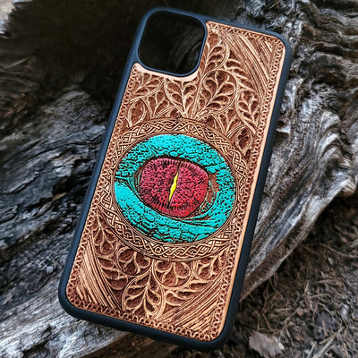 Gothic dragon eye artwork engraved on a wooden phone case, compatible with iPhone  and Samsung Galaxy S.
