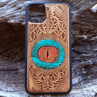 Dragon eye gothic artwork engraved on a wooden phone case, compatible with iPhone  and Samsung Galaxy S.