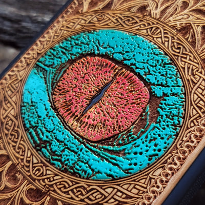 Dragon eye gothic artwork engraved on a wooden phone case, compatible with iPhone  and Samsung Galaxy S.