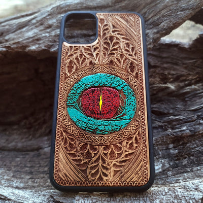 Gothic dragon eye artwork engraved on a wooden phone case, compatible with iPhone  and Samsung Galaxy S.