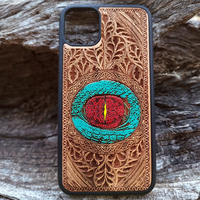 Gothic dragon eye artwork engraved on a wooden phone case, compatible with iPhone  and Samsung Galaxy S.