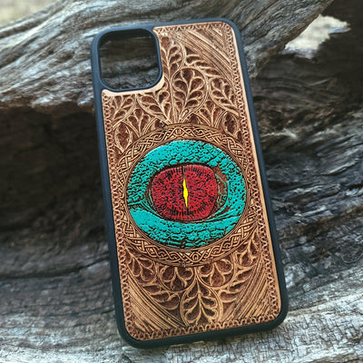 Gothic dragon eye artwork engraved on a wooden phone case, compatible with iPhone  and Samsung Galaxy S.