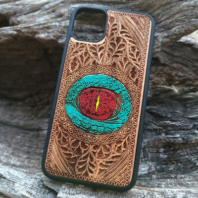 Gothic dragon eye artwork engraved on a wooden phone case, compatible with iPhone  and Samsung Galaxy S.