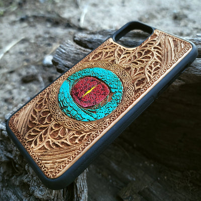 Gothic dragon eye artwork engraved on a wooden phone case, compatible with iPhone  and Samsung Galaxy S.