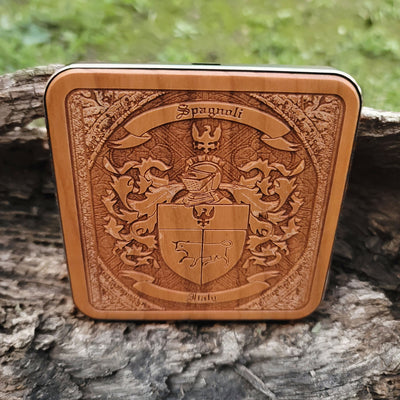 Personalized wooden wireless charging pad with engraved coat of arms design.