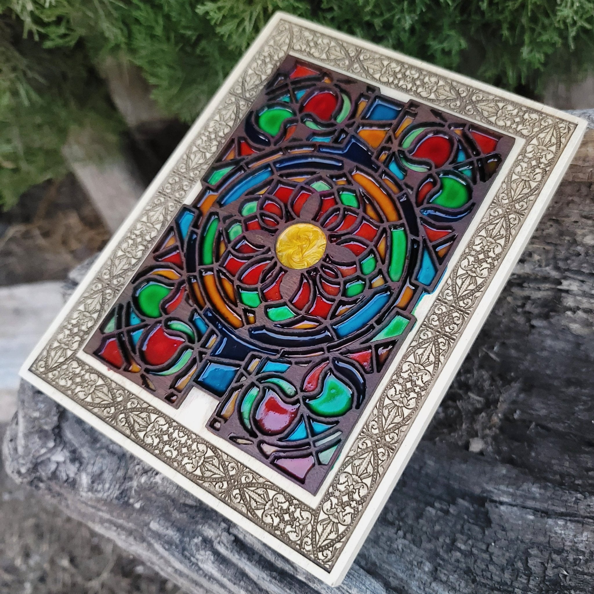 Gothic arch wood artwork with vibrant flower design and medieval influence.