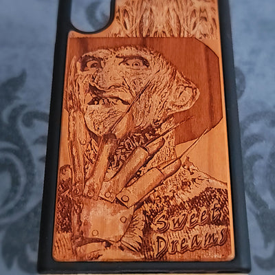 Laser-engraved wooden phone case with Freddy Krueger horror design, perfect for iPhone and Samsung Galaxy